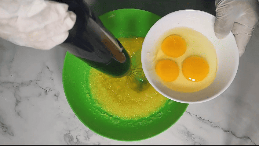 Gradually add the eggs to butter and sugar.