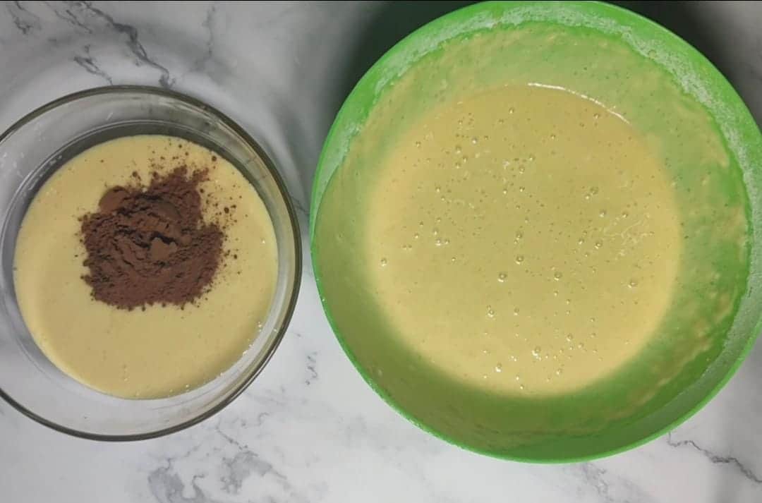 Remove some batter and add the cocoa powder to it to make chocolate cake batter.