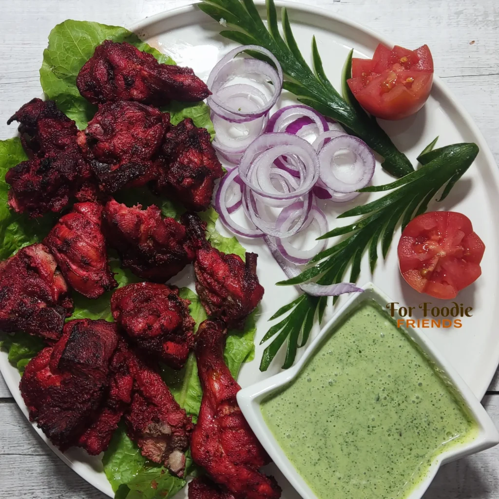 Tandoori Chicken made in oven served with fresh salad and mint chutney