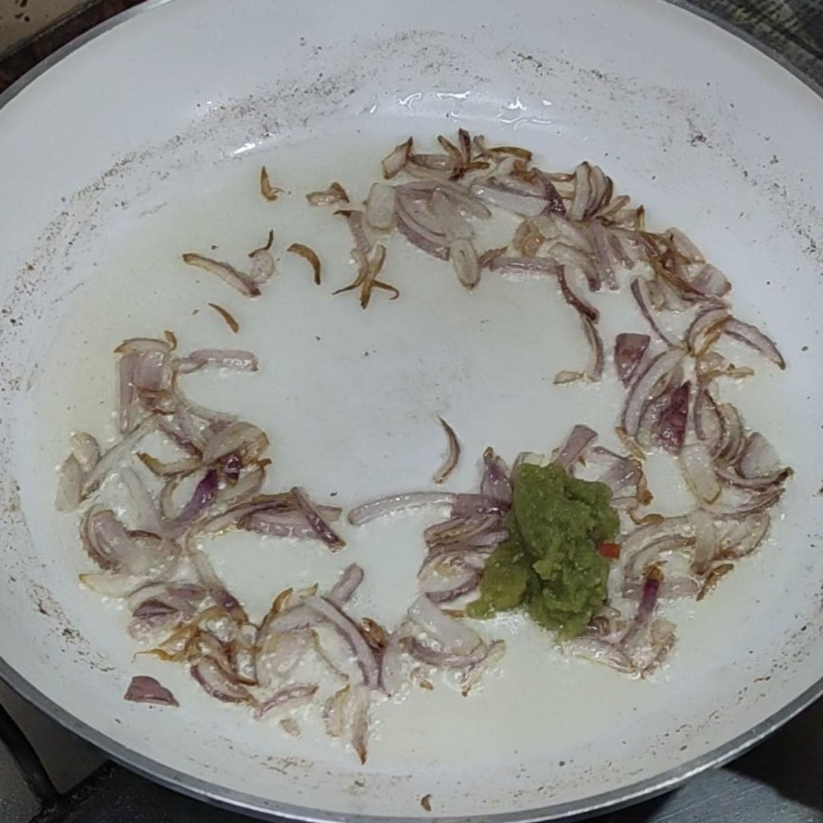 Add ginger garlic while sauting onion for making rajma masala