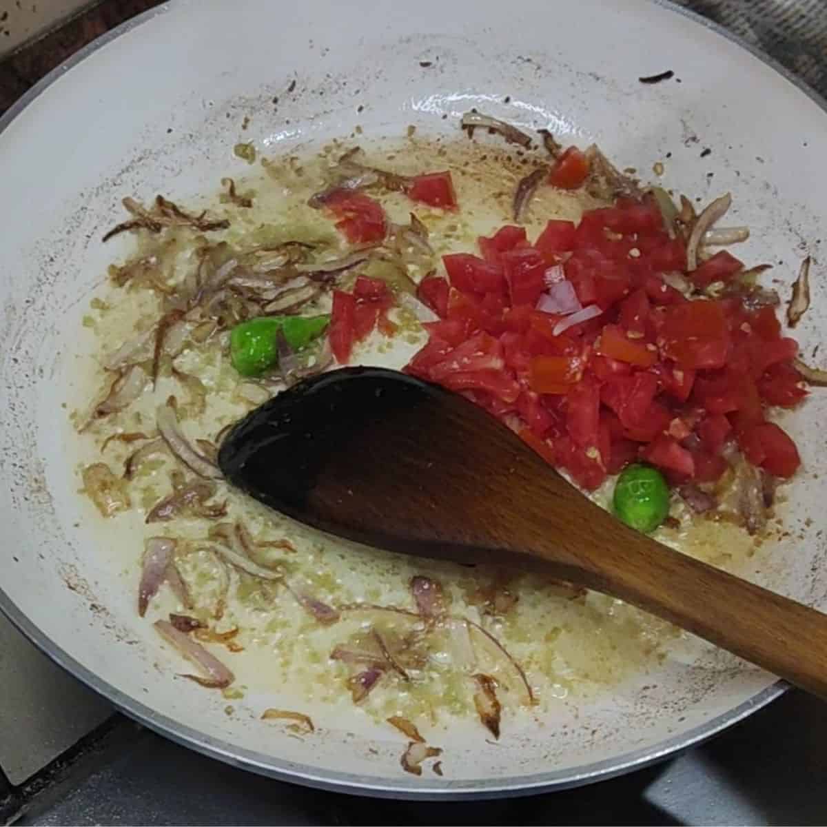 Add tomatoes & Green Chillies in pan to make rajma masala