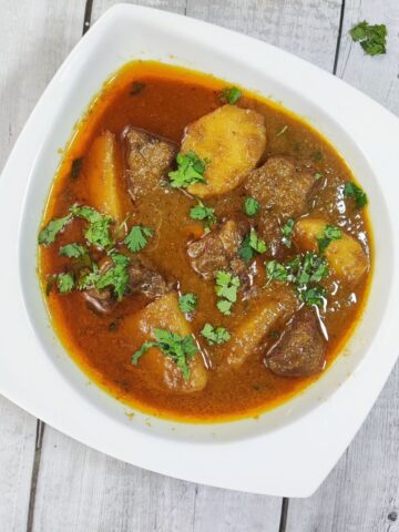 aloo gosht served in plate