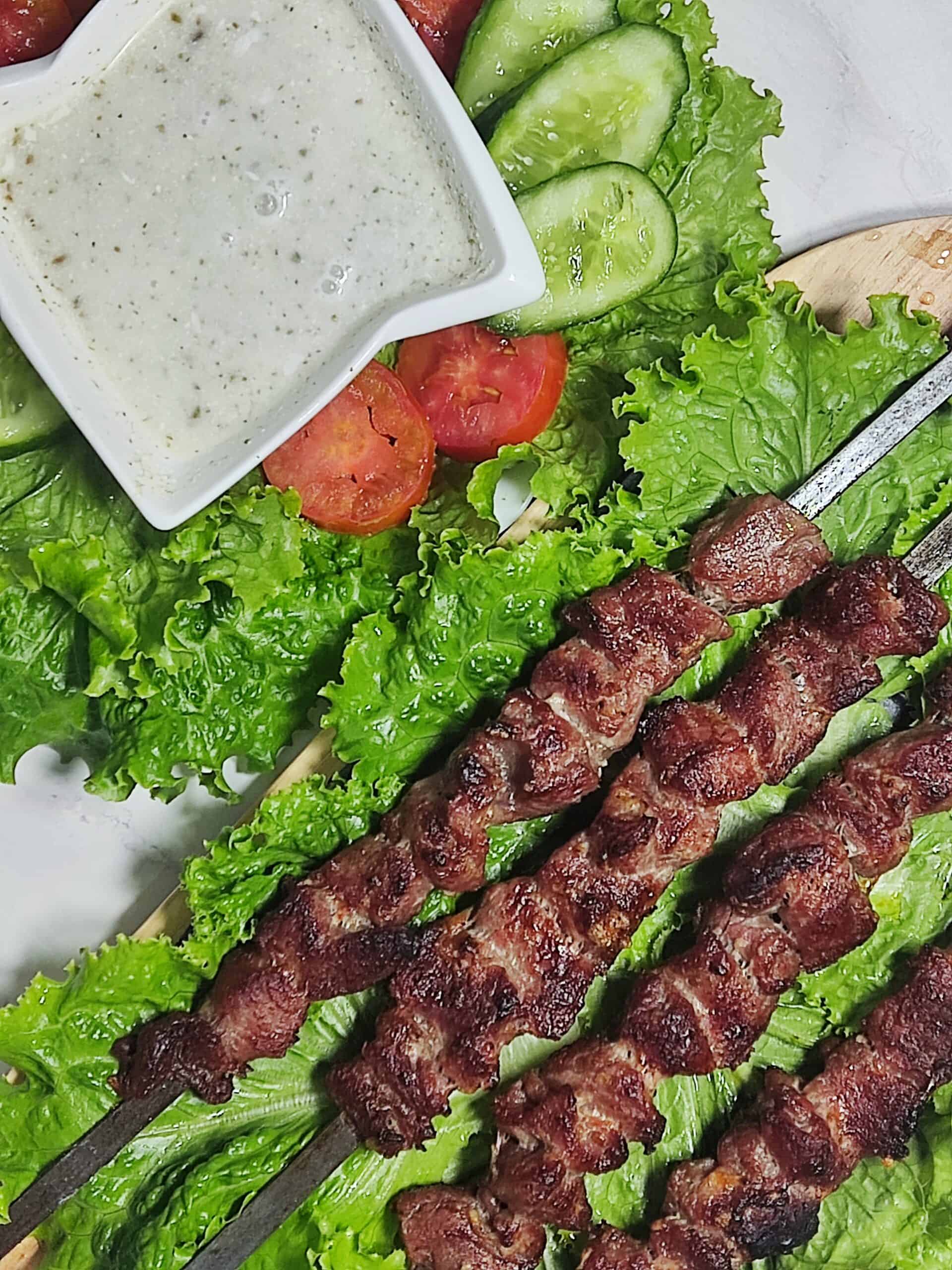 Serve the Namkeen beef boti with a yogurt sauce and fresh salad.