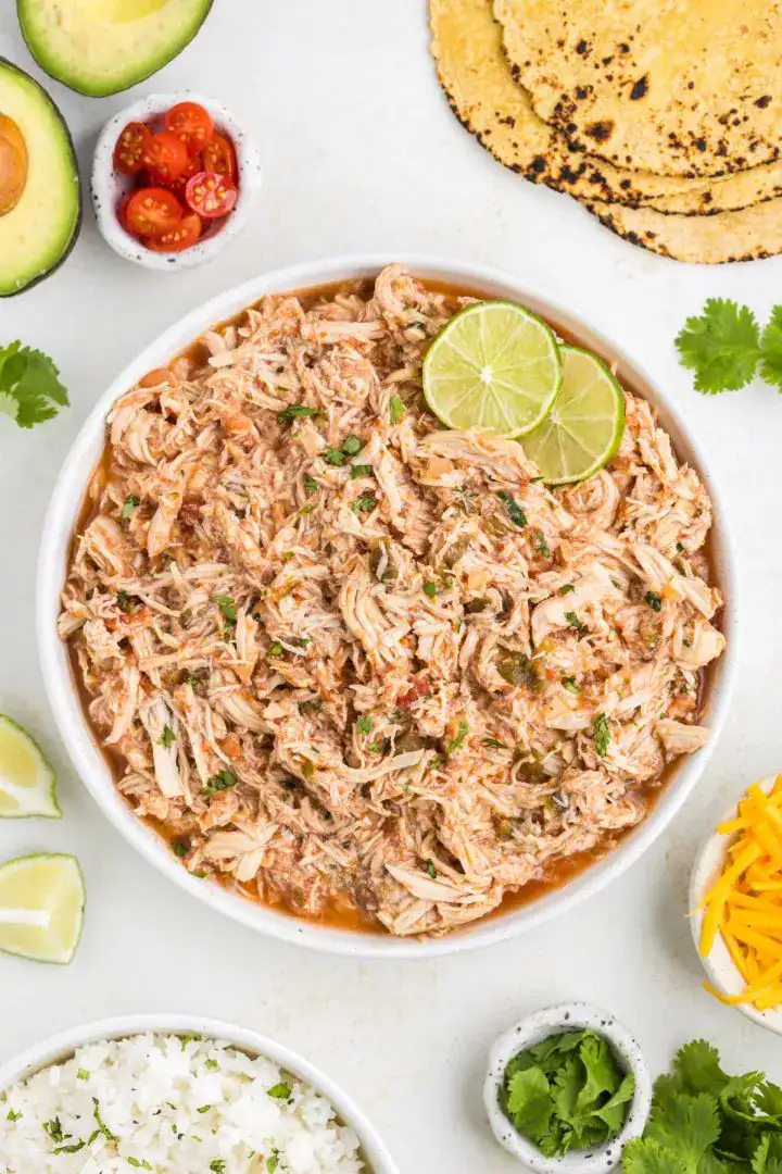 slow cooker salsa chicken three-ingredient chunky salsa shredded versatile tacos burritos meal-prep weeknight easy