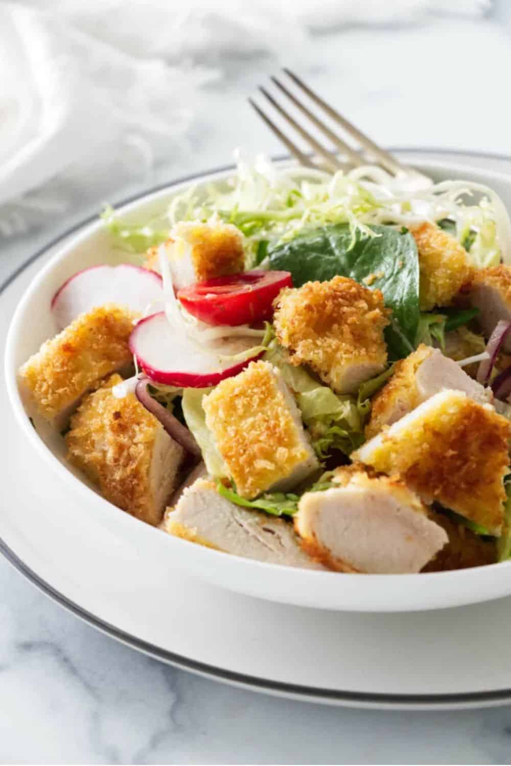 crispy chicken salad honey tarragon vinaigrette breaded golden cherry tomatoes mixed greens bistro-style elegant lunch