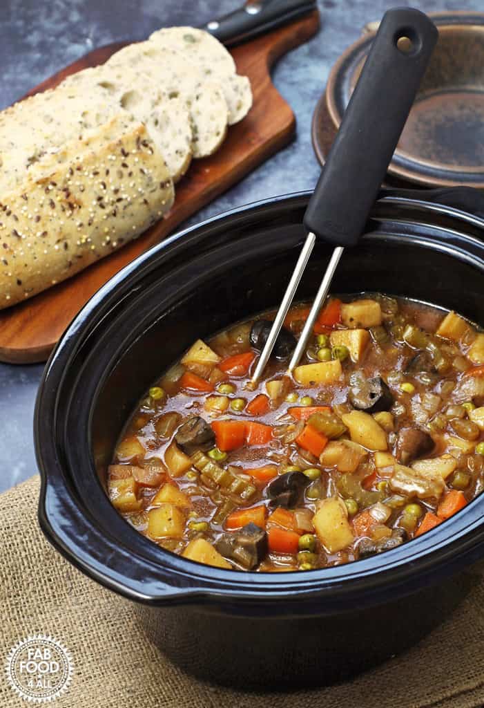 vegan slow cooker stew tangy fat-free hearty root vegetables potatoes carrots tomato base plant-based satisfying healthy