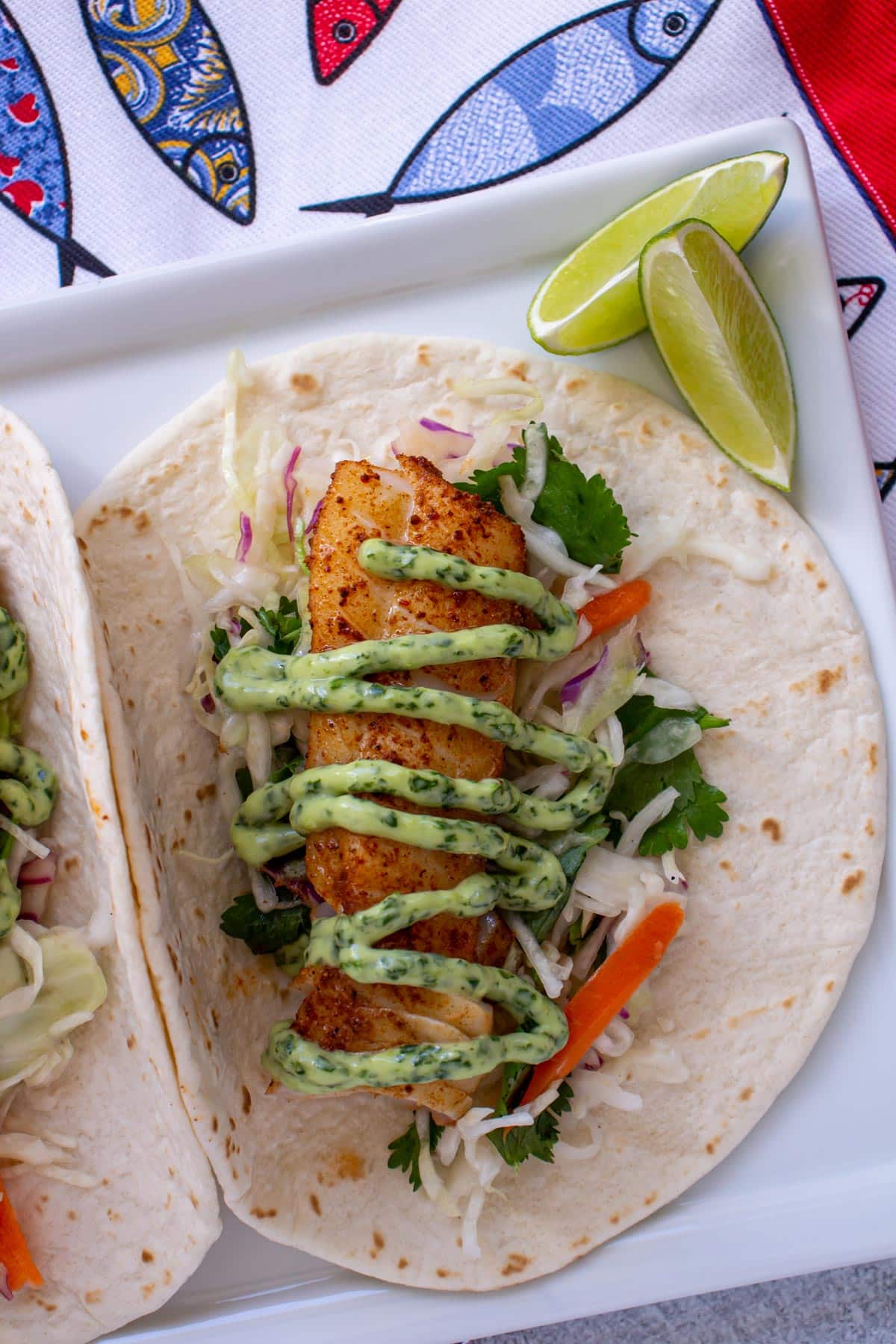 grilled fish tacos Disney Polynesian inspired citrus slaw cilantro lime mayo flavorful seasoned fish soft tortillas