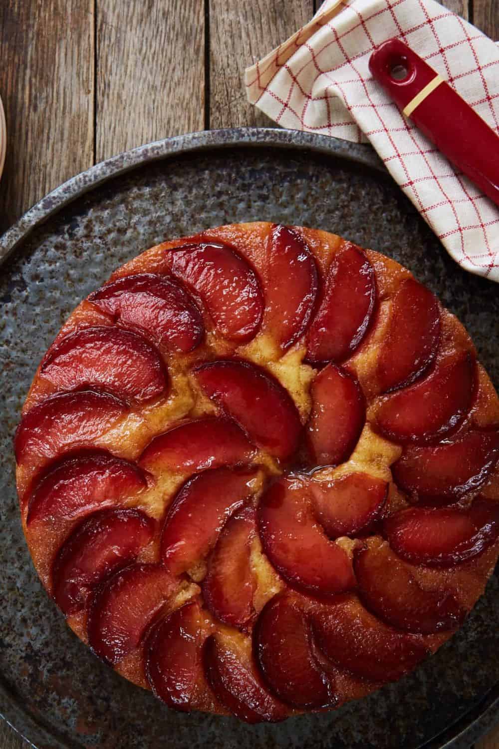 plum upside down cake caramelized brown sugar butter top single layer black red plums tender crumb summer fruit