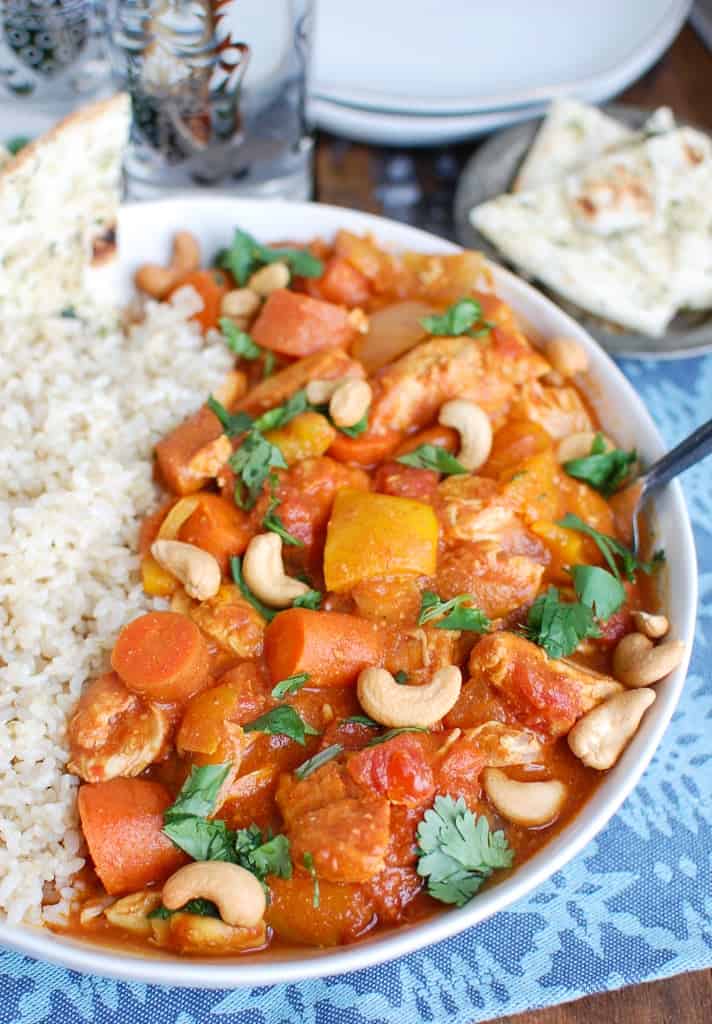 slow cooker chicken curry coconut milk Indian-inspired aromatic spices ginger garlic onion tender thighs basmati rice naan