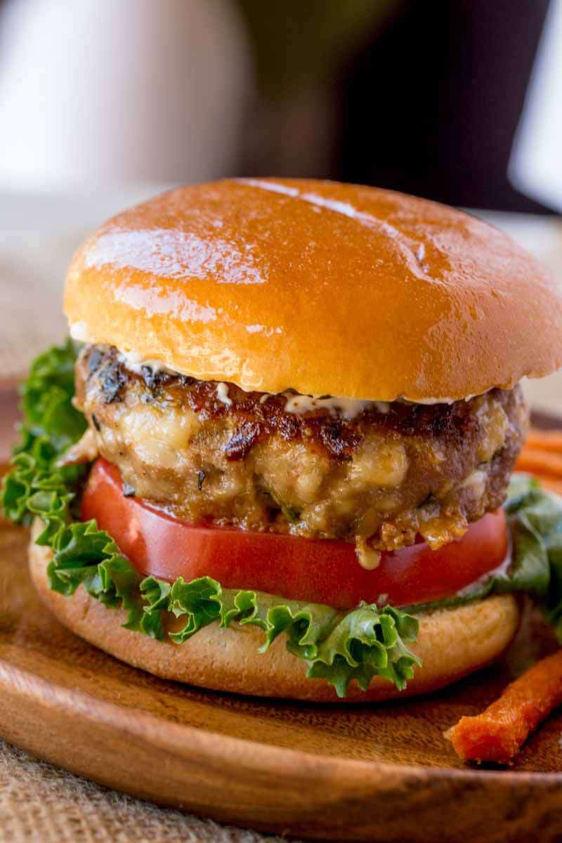 spinach feta turkey burgers stuffed Mediterranean garlic-yogurt sauce roasted red peppers caramelized onions elevated