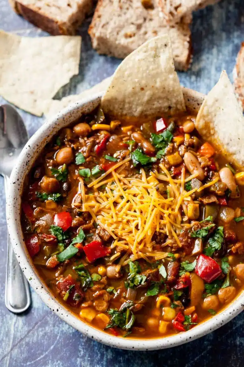 vegetarian chili slow cooker stovetop three beans bell peppers tomatoes mushrooms hearty plant-based meatless filling