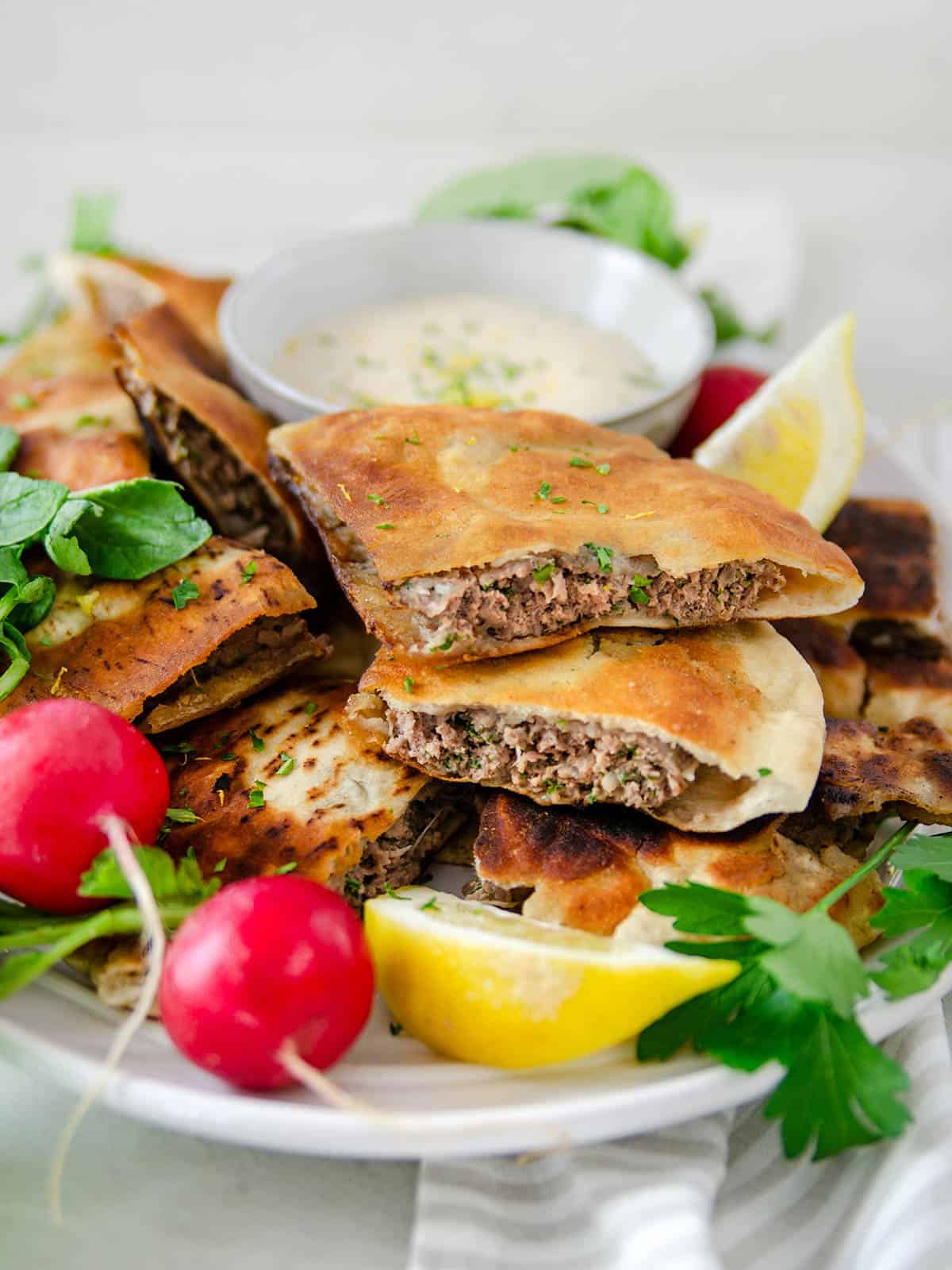 arayes Middle Eastern stuffed pitas spiced ground beef lamb tahini sauce crispy grilled street food appetizer