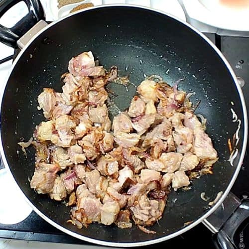 Lamb sautéing until color changes to golden
