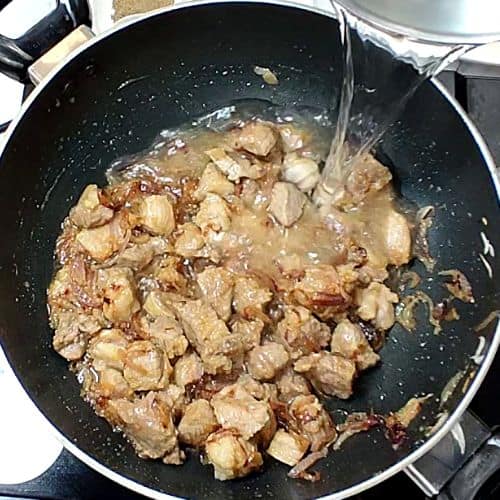 Water added to browned lamb