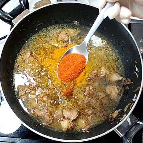 Red chili powder added to moong gosht