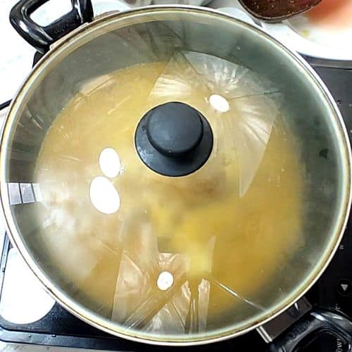 Pan covered and lamb cooking