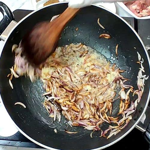 Sautéing ginger garlic paste with onions