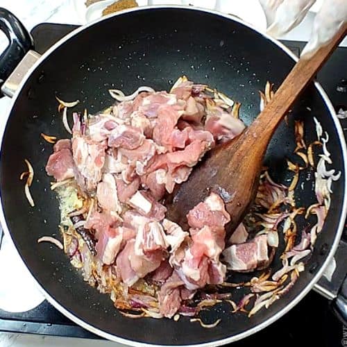 Lamb pieces added to the pan and sautéed