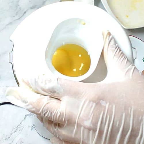 Blending mango shake until smooth and creamy
