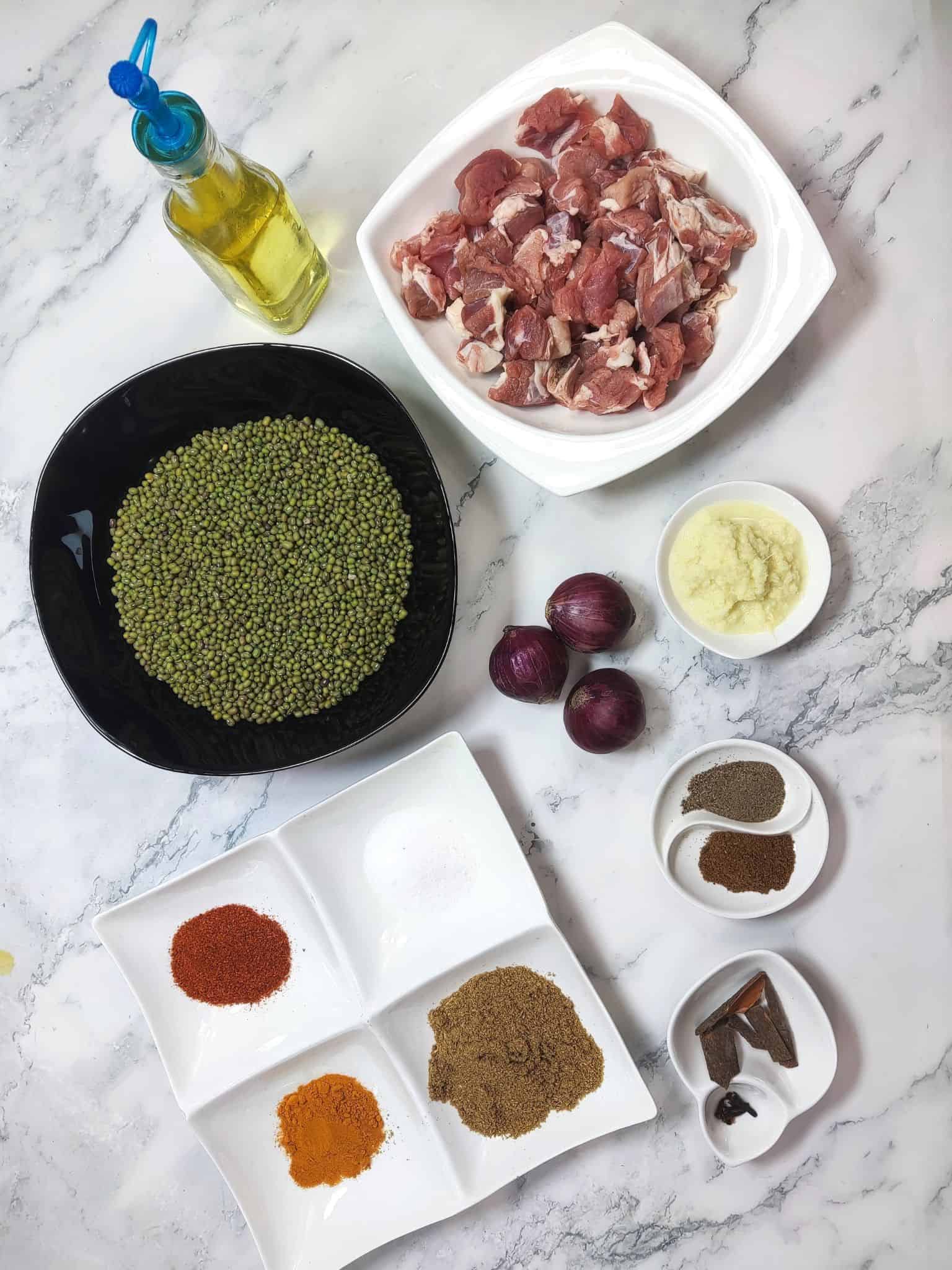 Moong dal gosht ingredients including moong dal lamb and spices