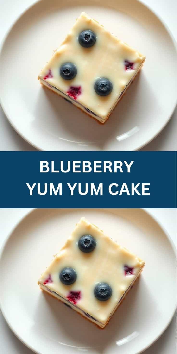 Square blueberry cake slice with cream frosting and fresh blueberries on white plate.
