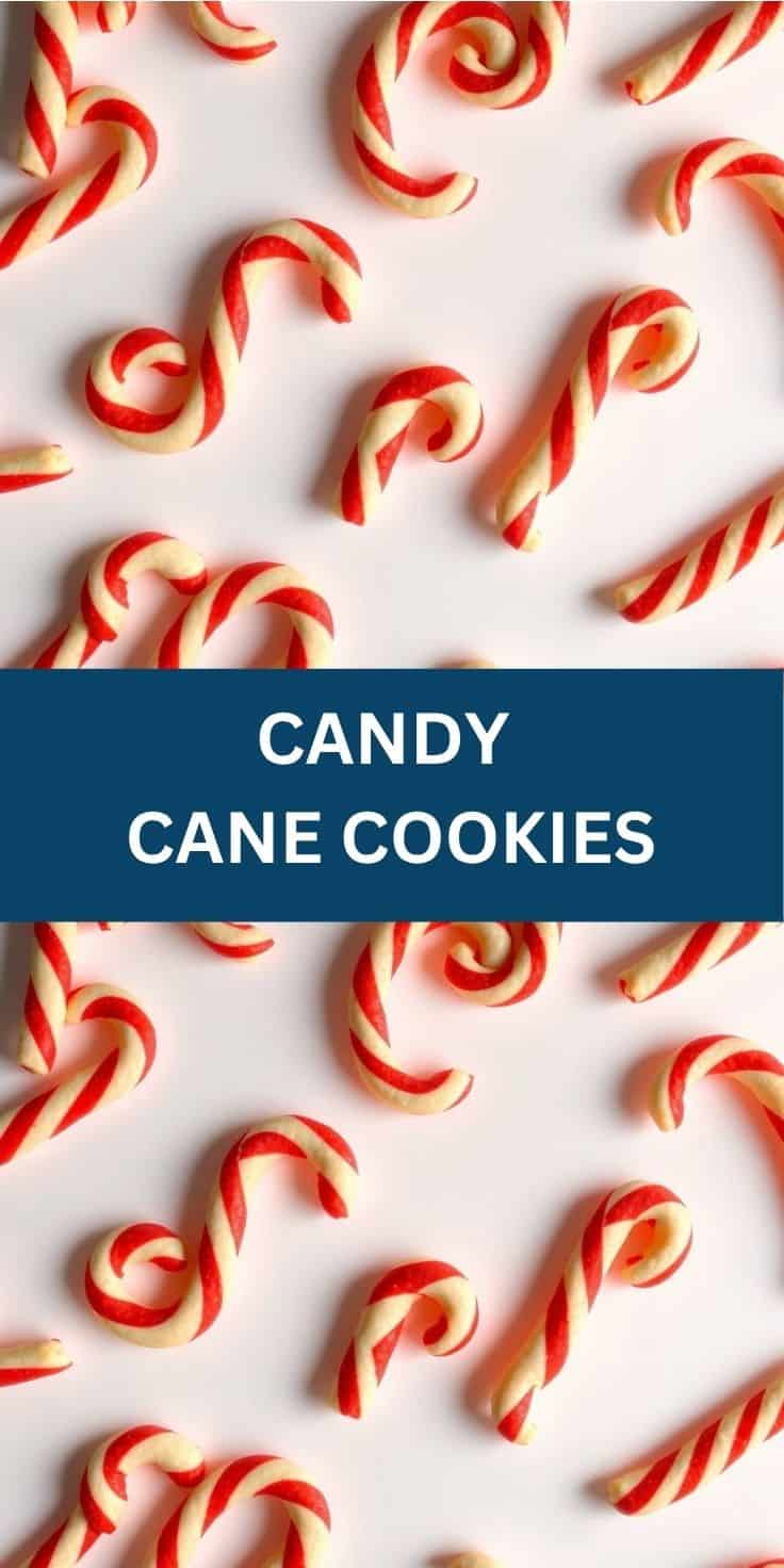 Red and white striped candy cane cookies arranged on white background in flat lay.