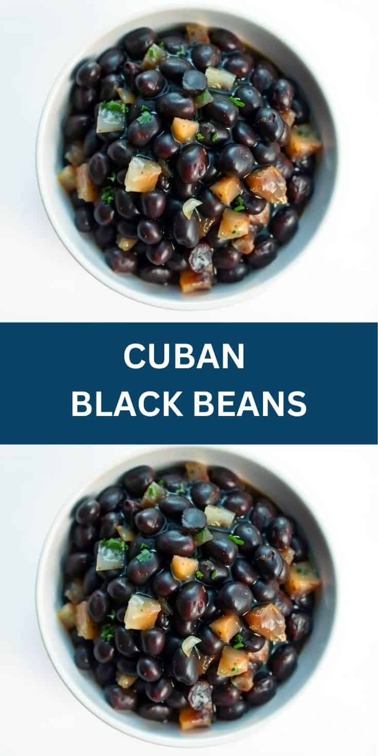 Cuban black beans in white bowl, garnished with diced onions, peppers, and fresh cilantro.