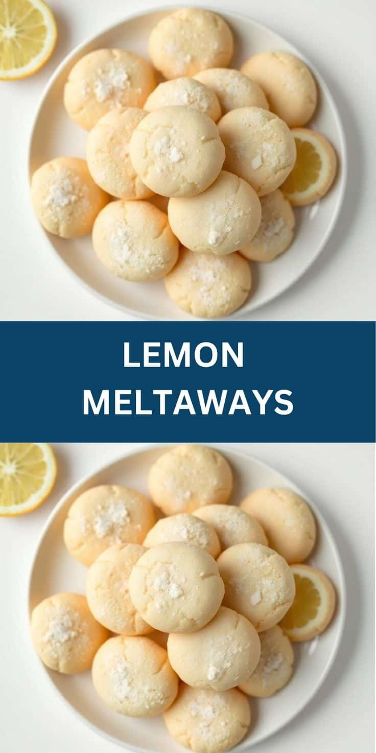 Lemon meltaways dusted with powdered sugar on a white plate, garnished with lemon slices.