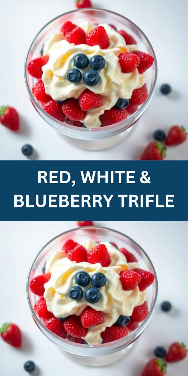 Red, white, and blueberry trifle in clear glass bowl with whipped cream, raspberries, and blueberries.