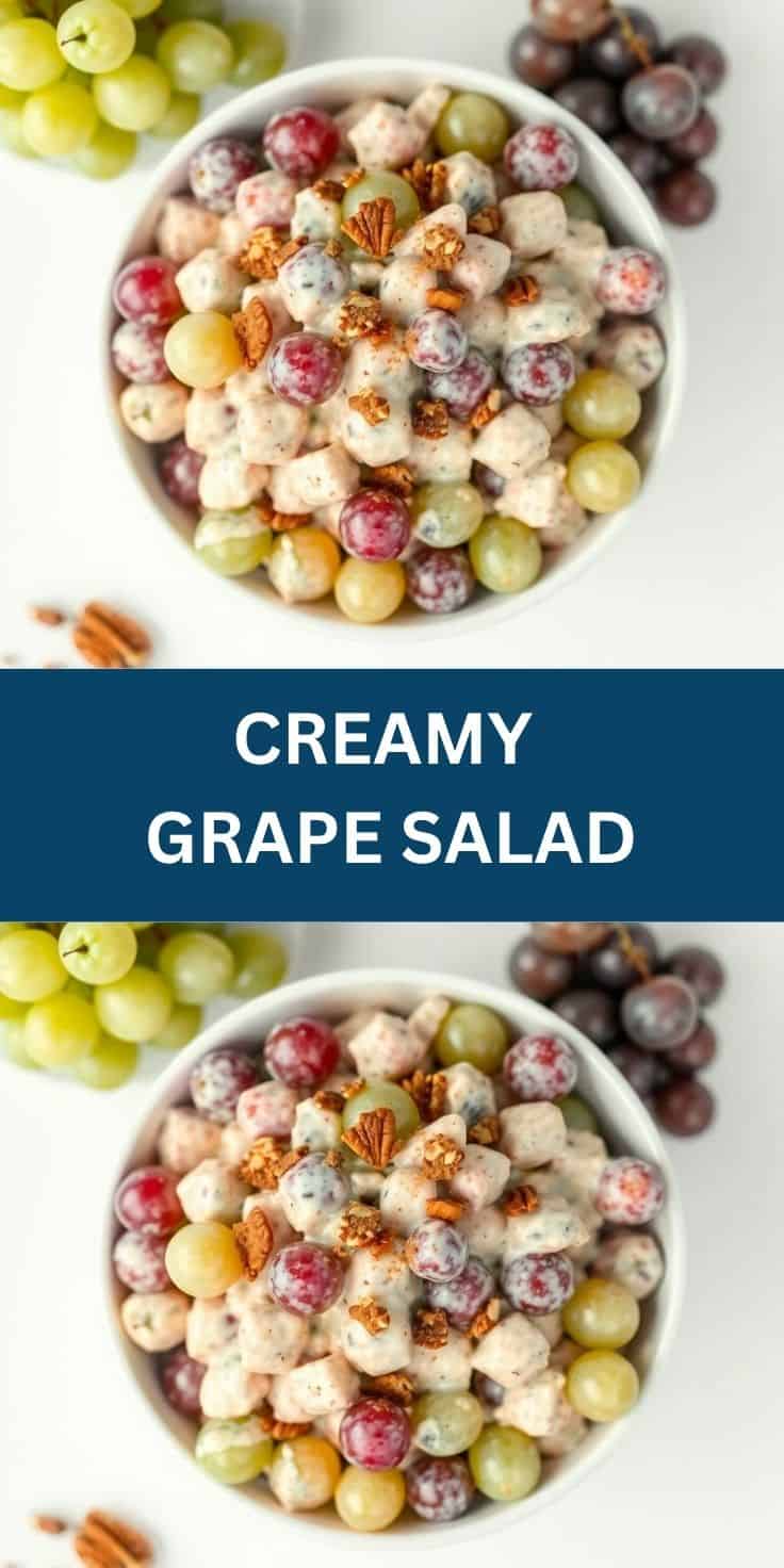 Creamy grape salad in white bowl with red and green grapes, marshmallows, and chopped pecans.