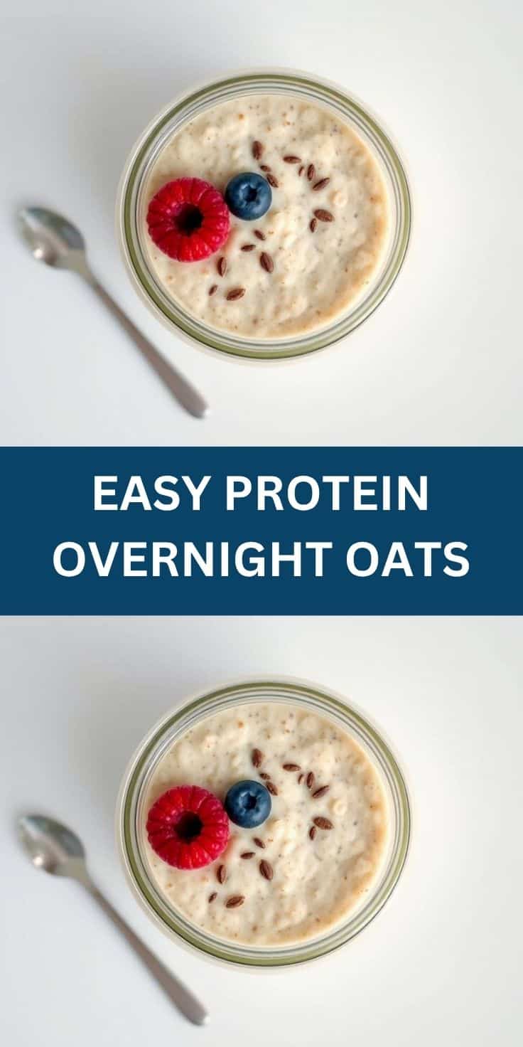 Protein overnight oats in glass jar topped with raspberry, blueberry, and granola seeds.