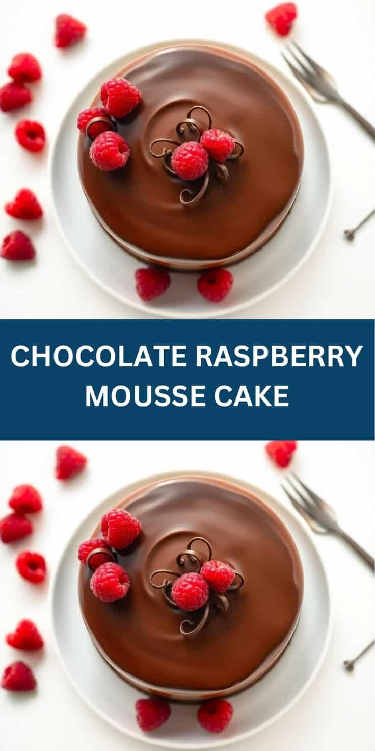 Chocolate raspberry mousse cake topped with fresh raspberries and chocolate curls on white plate.