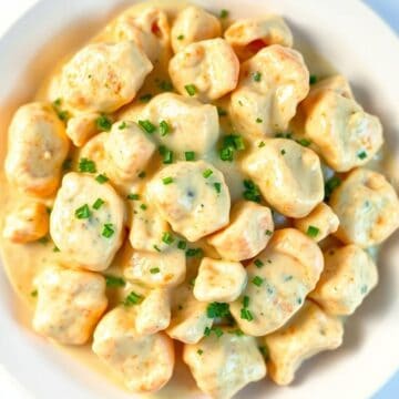 creamy butter garlic crab plated close up elegant seafood dinner