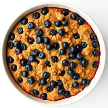Delicious blueberry dump cake topped with fresh blueberries and a buttery crumble, perfect for easy.