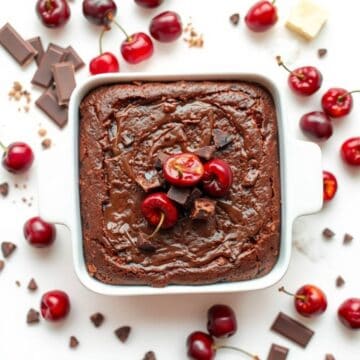Delicious roasted chocolate cherry brownies topped with fresh cherries and chocolate chunks. Perfect.
