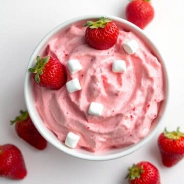 Creamy strawberry fluff topped with fresh strawberries and mini marshmallows.