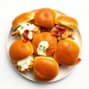 Delicious chicken bacon ranch sliders with creamy sauce and crispy bacon on soft buns. Perfect for p.