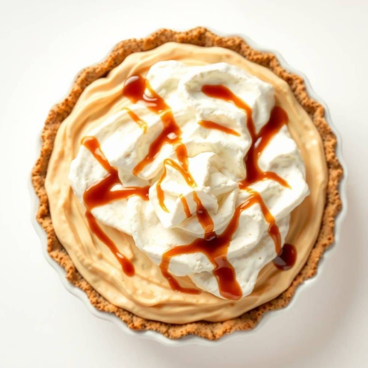 Delicious root beer float pie topped with whipped cream and caramel drizzle.