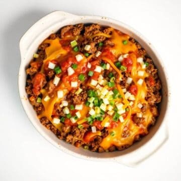 Delicious Sloppy Joe casserole topped with cheese and green onions.