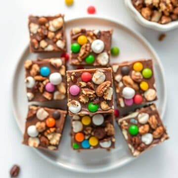 Delicious fantasy fudge topped with colorful candies and nuts, perfect for sweet cravings.